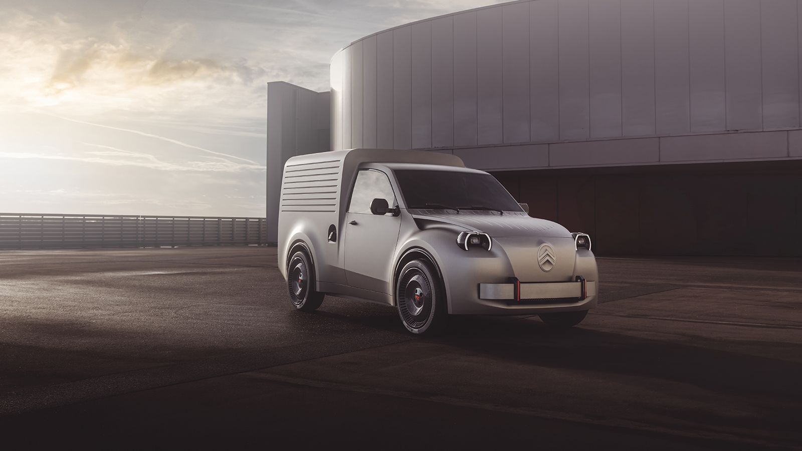 Εμπρός τρία τέταρτα άποψη του γκρι Citroen 2CV Fourgonnette concept van σε ανοιχτό εξωτερικό χώρο με συννεφιασμένο ουρανό.