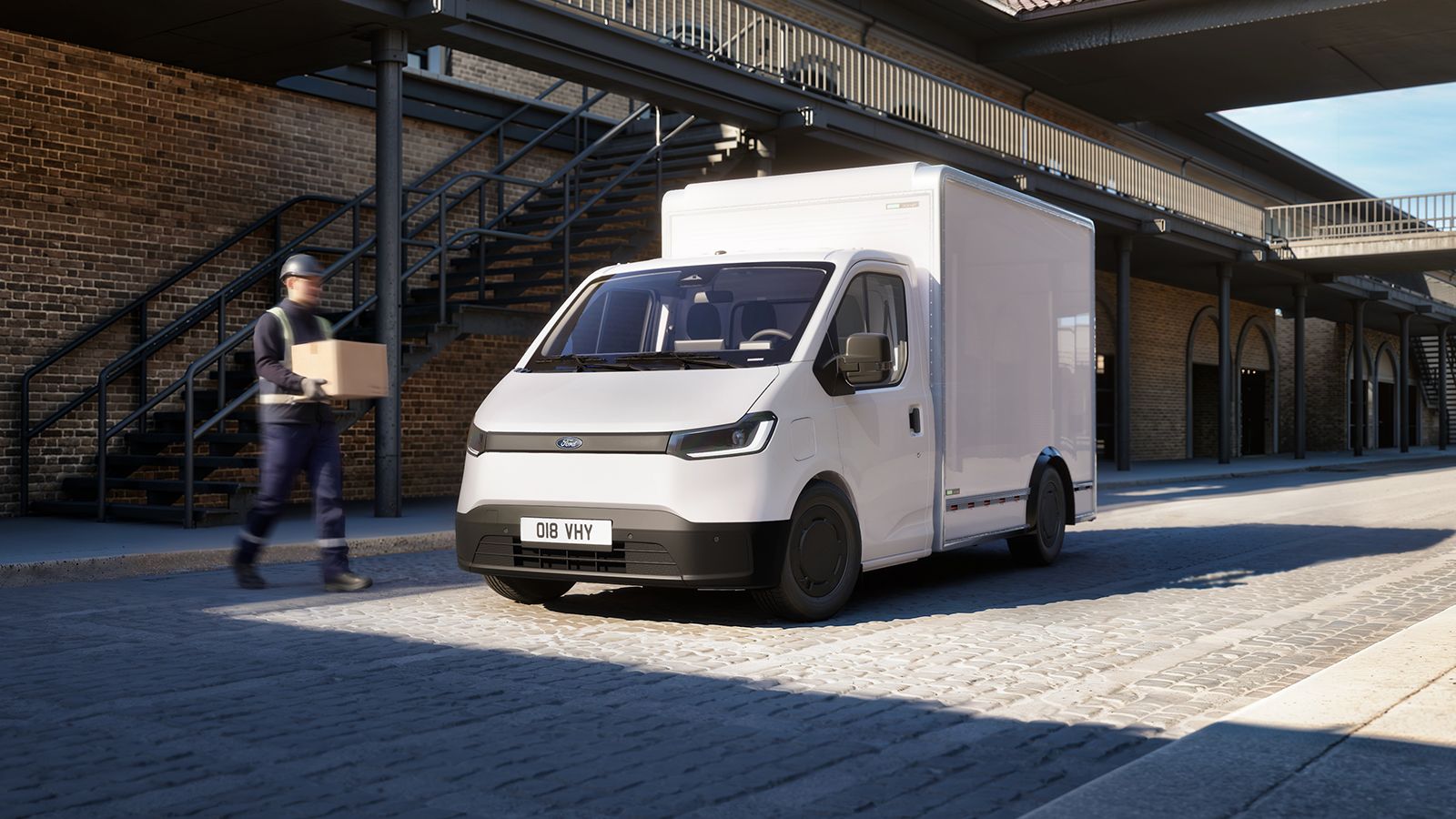 Λευκό Ford Transit City Chassis Cab με κλειστό αμάξωμα box Van σε αστικό περιβάλλον.