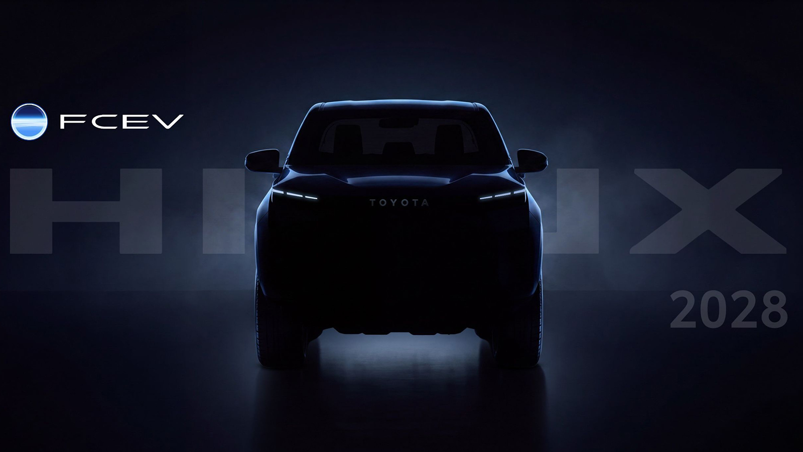 Η πρώτη σκοτεινή εικόνα προαναγγελίας του Toyota Hilux FCEV, το οποίο έχει προγραμματιστεί για παραγωγή το 2028. Η πρώτη σκοτεινή εικόνα προαναγγελίας του Toyota Hilux FCEV, το οποίο έχει προγραμματιστεί για παραγωγή το 2028.
